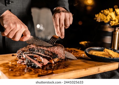 Cut and Served Table Side Tomahawk Steak inside intimate steakhouse restaurant