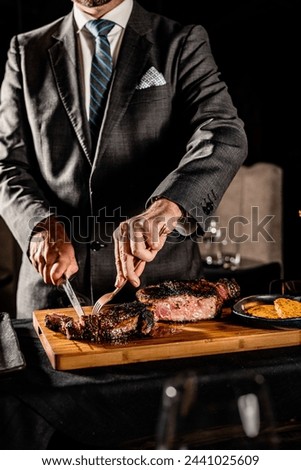 Cut and Served Table Side Tomahawk Steak inside intimate steakhouse restaurant