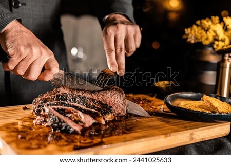 Cut and Served Table Side Tomahawk Steak inside intimate steakhouse restaurant