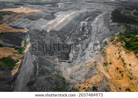 Cut of soil with layers of minerals of coal and clay, aerial top view. Stock photo © 