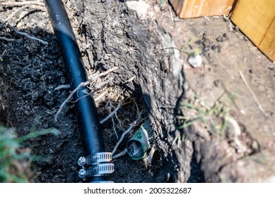 Cut Sprinkler Water Line With Repair Line Attached In An Open Trench