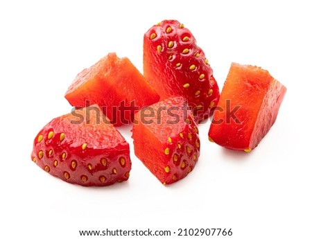 Cut strawberry pieces isolated on white. Chopped strawberry close up.