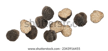 Cut and whole truffles falling on white background Foto d'archivio © 