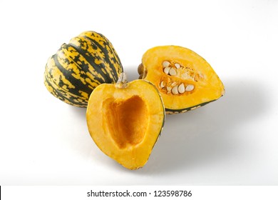 Cut And Whole Winter Squash On White Background With Shadows.