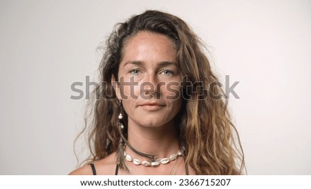 Cute 30s woman look camera. Hawaii girl face portrait. Australian person. One 40s years old lady head shot. Caucasian skin care cream. hair style. No make up life. Green eyes close. White background.