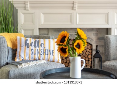 Cute Accent Pillow That Says Hello Sunshine On A Living Room Chair In Stylish And Cozy Home Interior