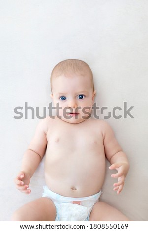 Similar – Baby girl four months old having her bath