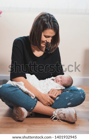 Similar – Image, Stock Photo Mother giving bottle to her newborn