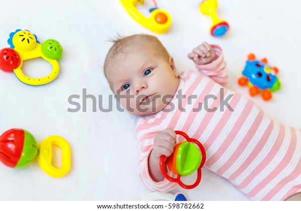 newborn baby playing toys