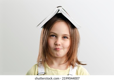 Cute Adorable Toddler Smiling Happy Stand Holding Book Over Head