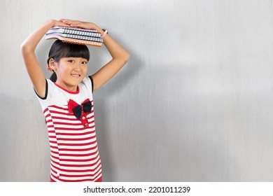 Cute Adorable Toddler Smiling Happy Stand Holding Book Over Head