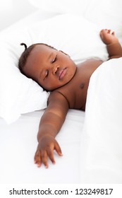 Cute African American Baby Boy Sleeping On Bed