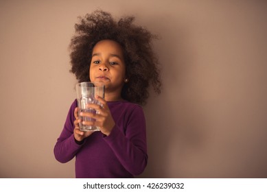 Cute African American Girl Drinking Water.