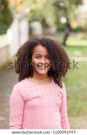 Similar – Cute African American girl smiling in the street with afro hair