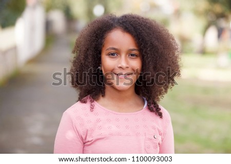 Similar – Cute African American girl smiling in the street with afro hair