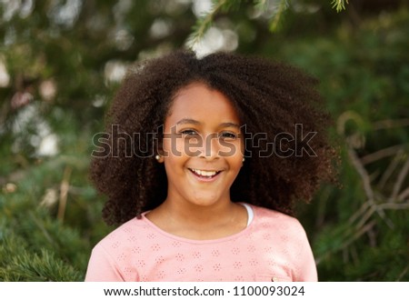 Similar – Cute African American girl smiling in the street with afro hair