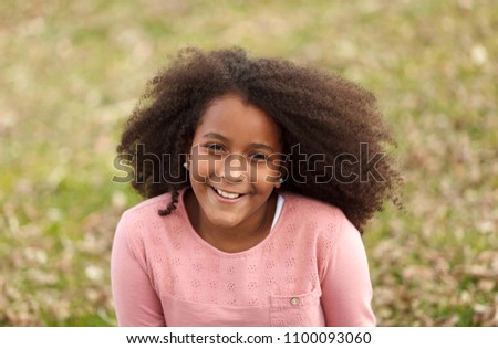 Similar – Cute African American girl smiling in the street with afro hair