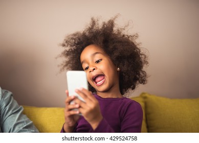 Cute African American Kid Making Crazy Selfie.