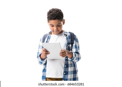 Cute African American Schoolboy Using Digital Tablet Isolated On White