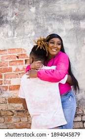 Cute African American Young Couple Hugging And Hanging Out In An Urban Setting While On A Date