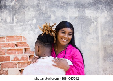 Cute African American Young Couple Hugging And Hanging Out In An Urban Setting While On A Date