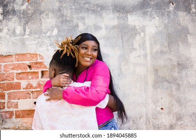 Cute African American Young Couple Hugging And Hanging Out In An Urban Setting While On A Date