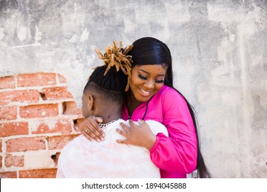 Cute African American Young Couple Hugging And Hanging Out In An Urban Setting While On A Date