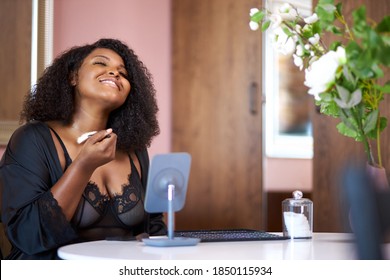 Cute Afro American Black Fat Woman Doing Make-up At Home, Use Decorative Cosmetics, Apply It On Face