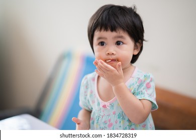 Cute Asian Baby Eating Spaghetti In The Dinning Room