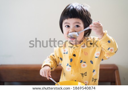 Similar – Image, Stock Photo portrait adorable child eating chocolate sponge cake