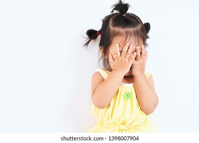 Cute Asian Baby Girl Closing Her Face And Playing Peekaboo Or Hide And Seek With Fun