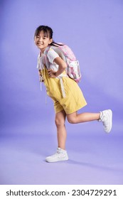 cute asian baby girl posing on purple background - Shutterstock ID 2304729291