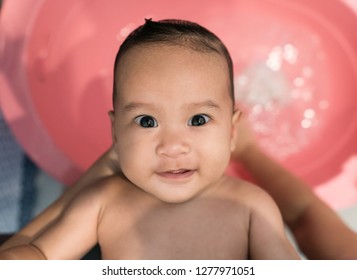 Cute Asian Baby Girl Take A Bath. Mom Cleaning Her Baby Hair.Selective Focus