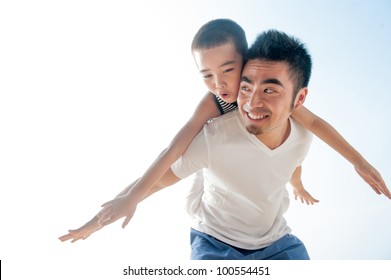 Cute Asian Boy Flying On Father