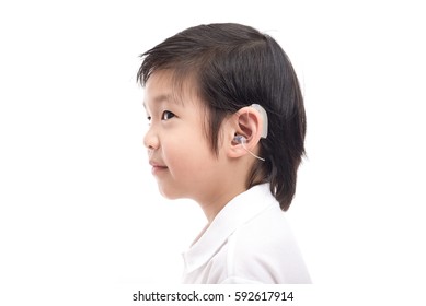 Cute Asian Child With Hearing Aid On White Background Isolated