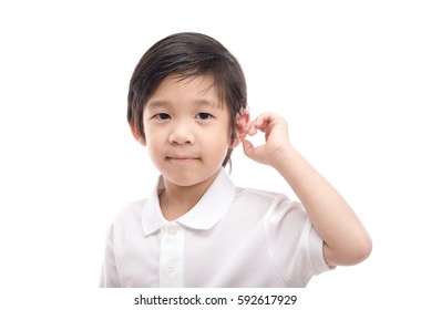 Cute Asian Child With Hearing Aid On White Background Isolated