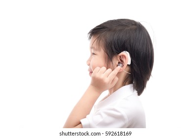 Cute Asian Child With Hearing Aid On White Background Isolated