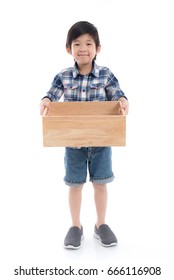 Cute Asian Child Holding Empty Wooden Box On White Background Isolated