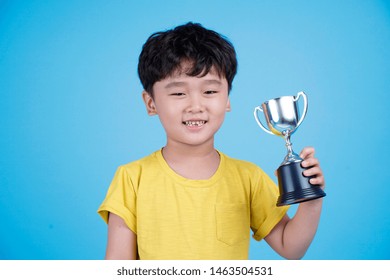 Cute Asian Child Holding Trophy On Stock Photo 1463504531 | Shutterstock