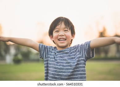 Cute Asian Child Playing Pilot Aviator In The Park Outdoors