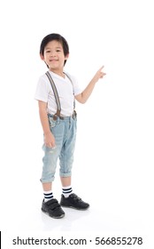 Cute Asian Child  In White T-shirt And Jeans Pointing On White Background Isolated