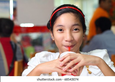 Cute Asian Girl Drinking A Soda