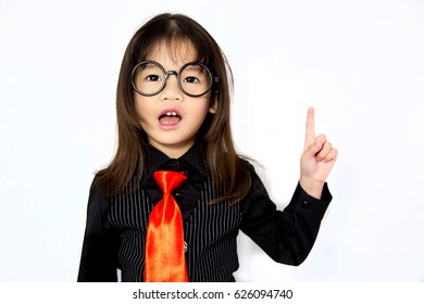 Cute asian girl wearing glasses who shocked and point finger on white background isolated