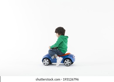 Cute Asian Kid Playing With Toy Car