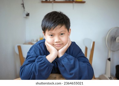 Cute Asian kids boy with white skin smiling and looking into the camera happy. Close-up portrait of a cute Asian thai kids boy - Shutterstock ID 2364655021