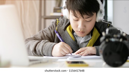 Cute Asian Teen Boy Doing Your Homework At Home.