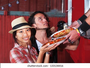 Cute Asian Woman With Carryout Pizza From Food Truck