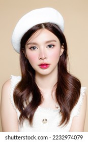 Cute Asian woman with perfect clear fresh skin. Pretty girl model wearing white beret and natural makeup on beige background. Cosmetology, beauty and spa, wellness, Plastic surgery. - Shutterstock ID 2232974079