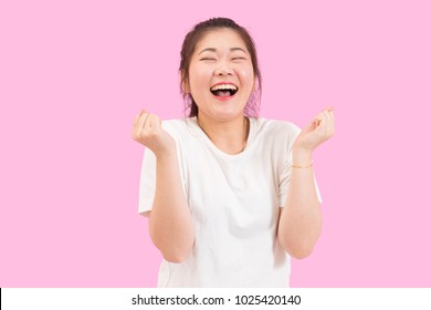 Cute Asian Woman Scream With Joy And Happiness, Suprise Feeling, Winner Expression, White Shirt, Pink Background