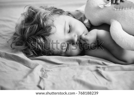 Similar – Newborn baby with pompom hat sleeping on blanket